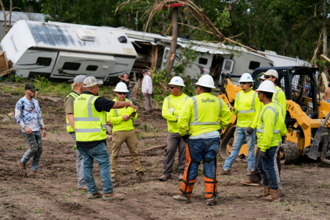 people-help-during-clean-up-efforts-at-guadalupe-keys-resort-an-rv-park-in-center-point-texas-after-flooding-monday-july-7-2025-ap-photoashley-landis