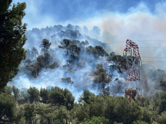 this-photo-provided-by-the-fire-brigade-sdis13-smoke-rises-during-a-wildfire-in-pennes-mirabeau-near-marseille-southern-france-tuesday-july-8-2025-sdis13-via-ap