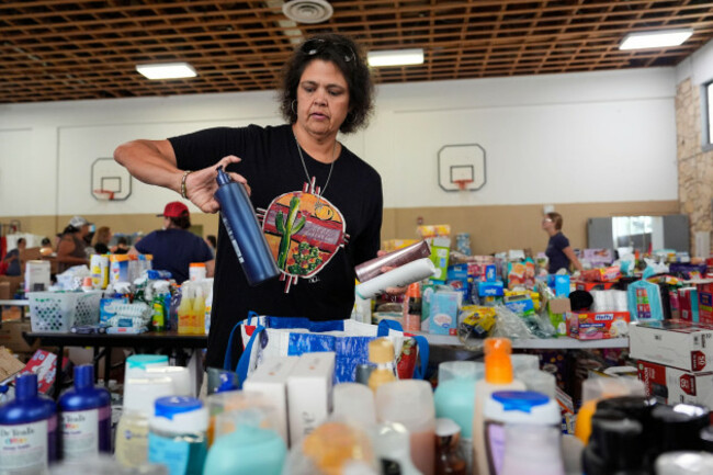 sonia-govea-helps-organize-donations-for-victims-of-flash-flooding-in-texas-inside-the-gym-at-center-point-elementary-in-center-point-texas-monday-july-7-2025-ap-photoashley-landis