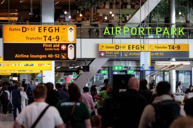 schiphol-passengers-walk-toward-their-gate-in-lounge-1-the-shopping-and-hospitality-area-after-the-security-check-at-schiphol-airport-most-european-vacation-flights-depart-from-this-terminal-an