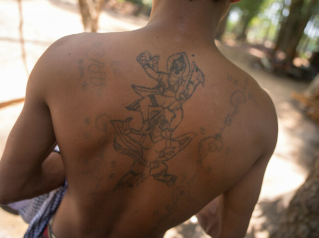 monk-with-buddhist-tattoos-lolei-temple-roluos-group-siem-reap-cambodia