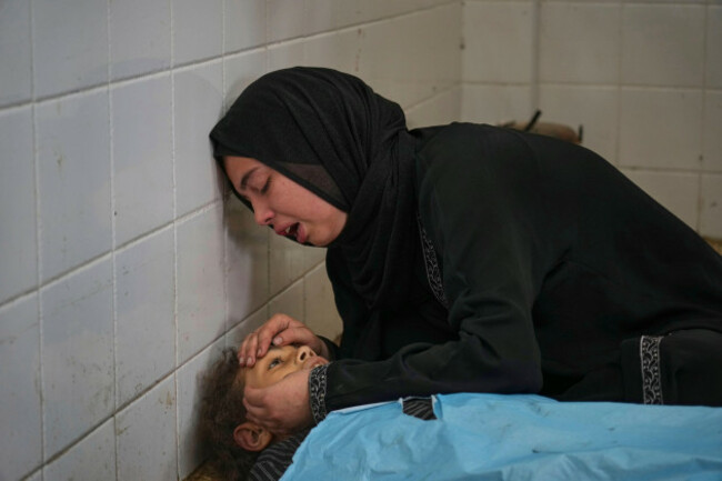 sara-al-nouri-mourns-over-the-body-of-her-13-year-old-sister-sama-who-was-among-10-people-including-two-women-and-five-children-killed-in-an-israeli-strike-while-they-were-waiting-to-receive-nutri