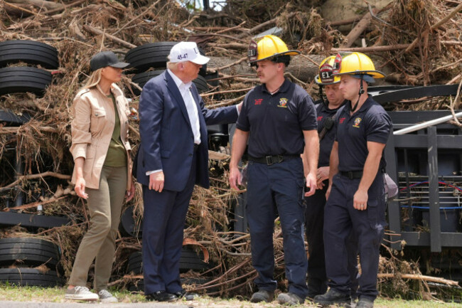 first-lady-melania-trump-from-left-and-president-donald-trump-greet-first-responders-as-they-observe-flood-damage-in-kerrville-texas-friday-july-11-2025-ap-photojacquelyn-martin
