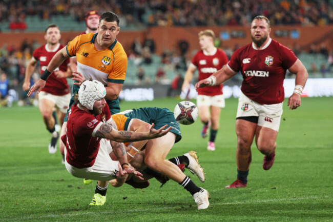 mack-hansen-of-the-british-irish-lions-passes-the-ball-as-he-is-tackled-during-the-rugby-match-between-the-lions-and-the-aunz-invitational-xv-in-adelaide-saturday-july-12-2025-ap-photojames-el