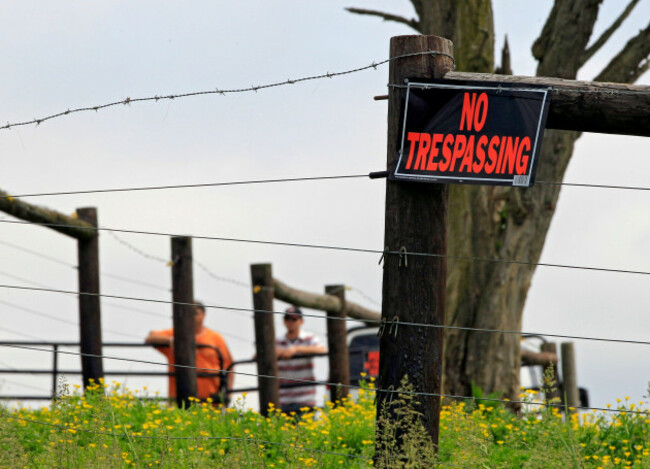 two-men-guard-the-gate-to-the-farm-of-marian-thompson-near-zanesville-ohio-friday-may-4-2012-the-columbus-zoo-returned-five-exotic-animals-to-thompson-the-survivors-of-56-animals-her-late-terry-t