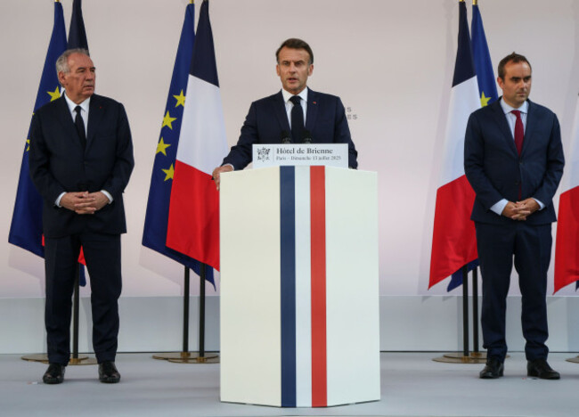 french-president-emmanuel-macron-speaks-to-the-army-leaders-flanked-by-prime-minister-francois-bayrou-left-and-defense-minister-sebastien-lecornu-at-the-hotel-le-brienne-sunday-july-13-2025-ahea