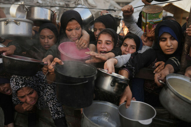palestinians-struggle-to-get-donated-food-at-a-community-kitchen-in-gaza-city-northern-gaza-strip-monday-july-14-2025-ap-photojehad-alshrafi