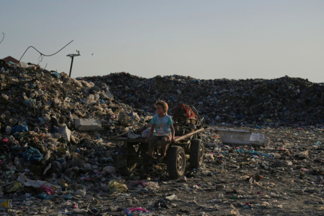 a-palestinian-girl-searches-through-a-landfill-for-firewood-plastic-and-canned-goods-in-al-zawaideh-central-gaza-strip-thursday-july-17-2025-ap-photoabdel-kareem-hana