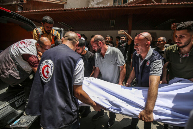 gaza-17th-july-2025-palestinians-carry-the-body-of-a-victim-after-an-israeli-drone-strike-on-the-holy-family-church-at-the-baptist-hospital-in-gaza-city-on-july-17-2025-two-people-were-killed-a
