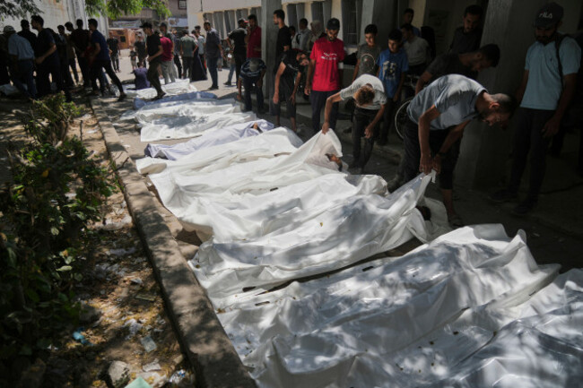 the-bodies-of-palestinians-who-were-killed-while-attempting-to-access-aid-trucks-entering-northern-gaza-through-the-zikim-crossing-with-israel-are-brought-to-a-clinic-in-gaza-city-sunday-july-20-20