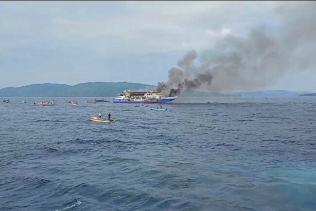 in-this-photo-made-from-video-released-by-the-indonesian-national-search-and-rescue-agency-basarnas-smoke-billows-from-passenger-ship-km-barcelona-after-it-caught-fire-in-the-waters-off-talise-isla