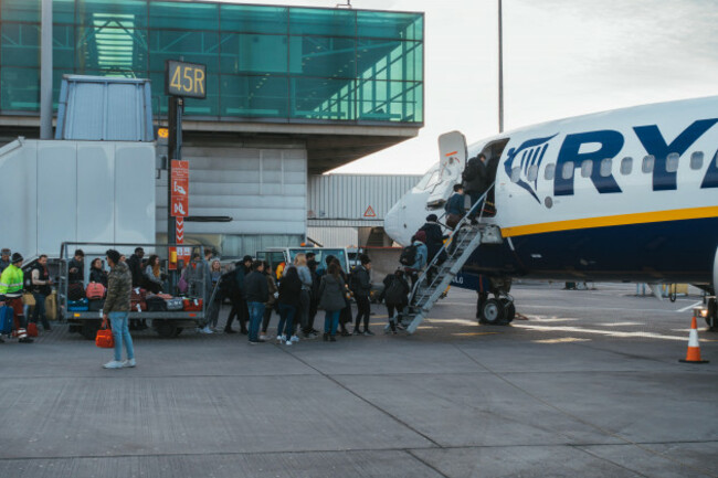 passengers-boarding-a-ryanair-jet-after-their-new-cabin-bag-policy-came-into-effect-requiring-them-to-forfeit-their-baggage-to-loading-crews