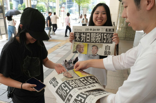an-extra-edition-of-japanese-daily-newspaper-is-published-reporting-that-the-united-states-of-america-and-japan-had-agreed-on-a-15-tariff-in-nagoya-city-aichi-prefecture-on-july-23-2025-u-s-presid