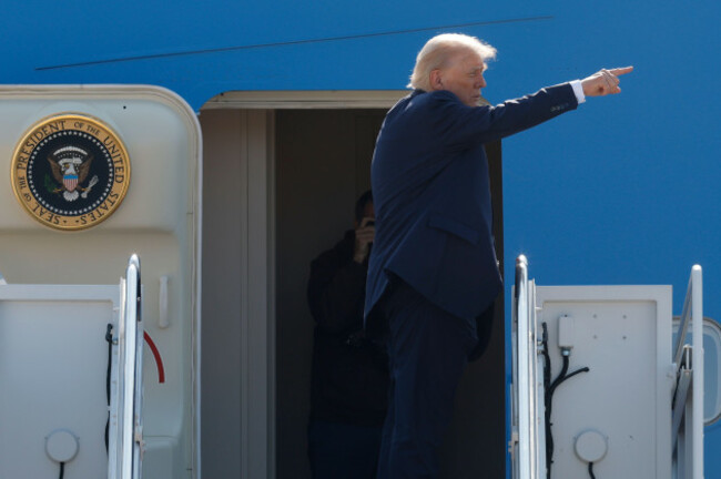 president-donald-trump-gestures-from-the-stairs-of-air-force-one-as-he-boards-upon-his-arrival-at-joint-base-andrews-md-friday-july-25-2025-ap-photoluis-m-alvarez