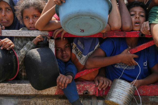 palestinians-struggle-to-get-donated-food-at-a-community-kitchen-in-gaza-city-northern-gaza-strip-saturday-july-26-2025-ap-photoabdel-kareem-hana