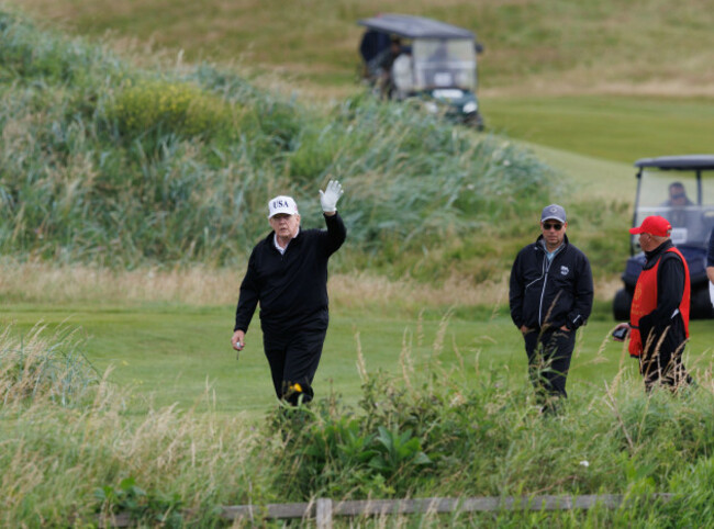 us-president-donald-trump-waves-to-reporters-while-playing-golf-at-his-trump-turnberry-golf-course-in-south-ayrshire-as-he-begins-his-five-day-private-trip-to-the-country-picture-date-saturday-july