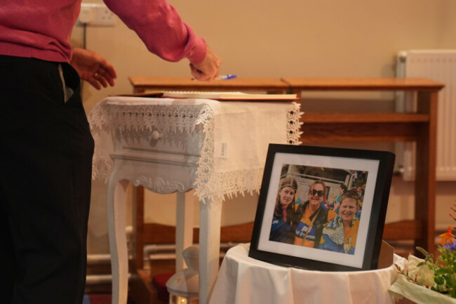 people-sign-a-book-of-condolences-during-a-prayer-service-at-the-church-of-the-immaculate-conception-barefield-republic-of-ireland-for-vanessa-whyte-and-her-children-james-and-sara-who-were-kille