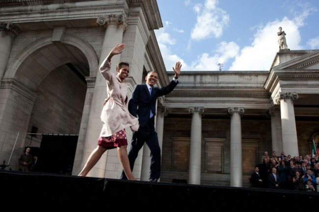 president-barack-obama-and-first-lady-michelle-obama-wave-to-the-crowd-as-they-take-the-stage-during-an-irish-celebration-at-college-green-in-dublin-ireland-may-23-2011