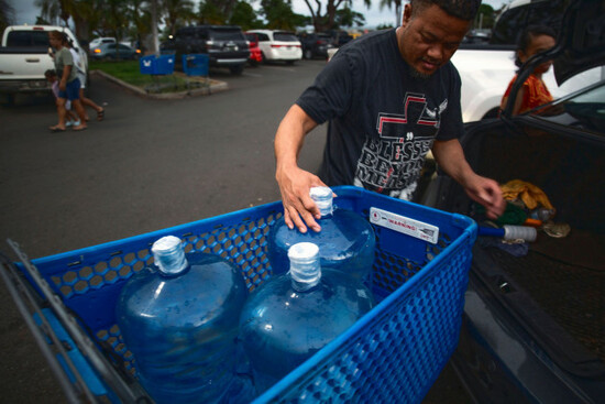 washington-state-resident-poppy-mellon-fills-his-car-with-jugs-of-water-in-preparation-for-the-tsunami-threat-at-the-kapolei-walmart-hawaii-tuesday-july-29-2025-ap-photomichelle-bir