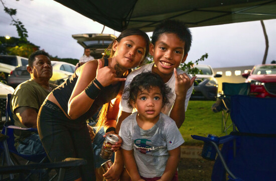 waianae-residents-jayda-marie-tili-jaylo-paris-and-kayson-tili-stand-with-their-families-as-they-were-evacuated-to-a-walmart-parking-lot-in-kapolei-hawaii-tuesday-july-29-2025-in-preparation-fo