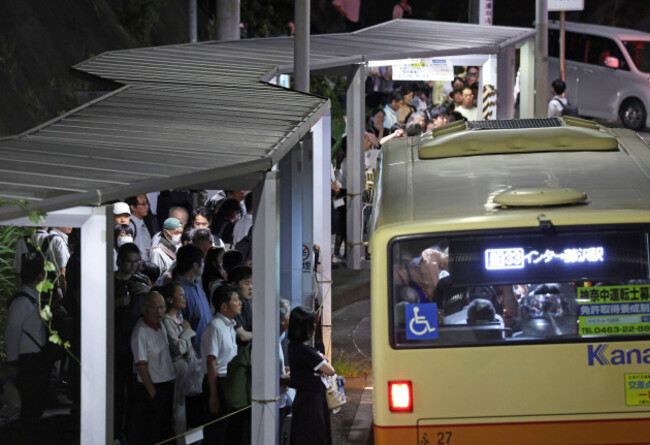 people-wait-for-taxi-in-front-of-ofuna-station-after-trains-were-stopped-due-to-tsunami-warning-in-kamakura-city-kanagawa-prefecture-on-july-30-2025-magnitude-of-8-8-massive-earthquake-occurred-off