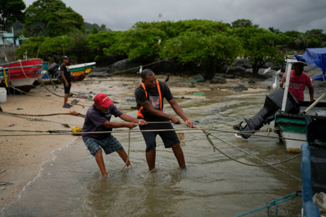 fishermen-pull-their-boats-on-to-the-shore-in-veracruz-panama-wednesday-july-30-2025-as-a-precaution-due-to-a-tsunami-warning-after-an-earthquake-struck-off-the-coast-of-russia-ap-photomatias