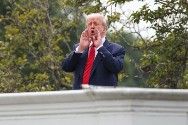 washington-united-states-05th-aug-2025-president-donald-trump-gestures-to-the-media-from-the-roof-of-the-west-wing-at-the-white-house-on-august-5-2025-in-washington-dc-photo-by-samuel-corumpoo