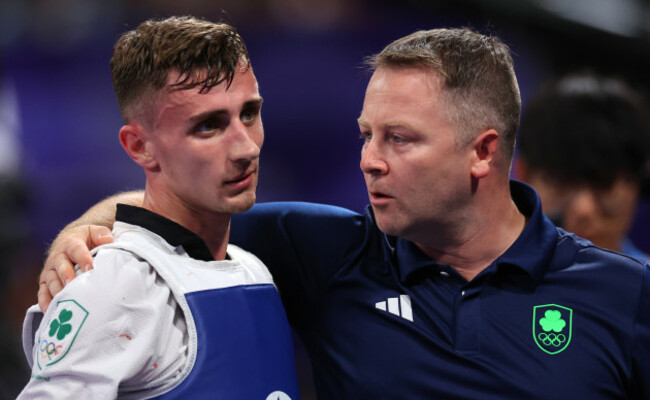 jack-woolley-is-consoled-by-coach-robert-taaffe-after-the-repechage