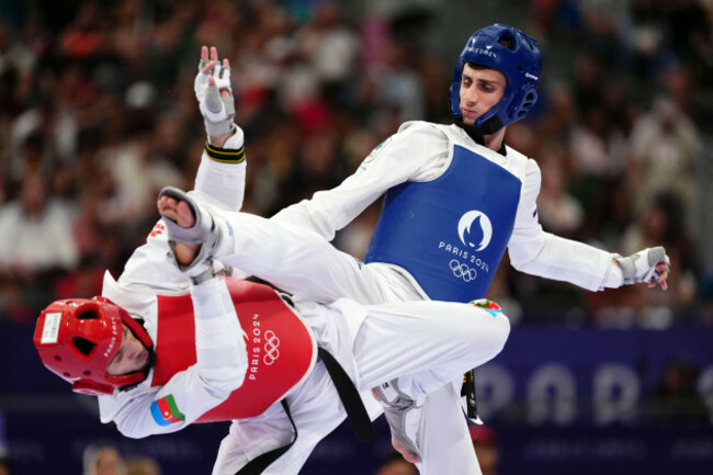irelands-jack-woolley-right-and-azerbaijans-gashim-magomedov-during-the-mens-taekwondo-58kg-round-of-16-bout-at-the-grand-palais-on-the-twelfth-day-of-the-2024-paris-olympic-games-in-france-pic