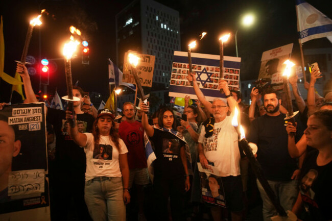 demonstrators-light-torches-during-a-protest-demanding-the-immediate-release-of-all-hostages-from-hamas-captivity-in-the-gaza-strip-and-calling-for-an-end-to-the-war-outside-the-prime-ministers-offi