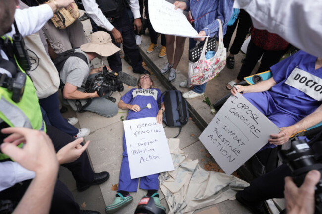 supporters-of-palestine-action-take-part-in-a-mass-action-in-parliament-square-westminster-central-london-organised-by-defend-our-juries-as-part-of-the-lift-the-ban-campaign-to-end-the-proscriptio