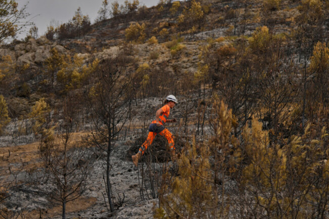 a-forestry-worker-operates-during-one-of-frances-largest-wildfire-in-decades-in-fontjoncouse-southern-france-friday-aug-8-2025-ap-photomanu-fernandez