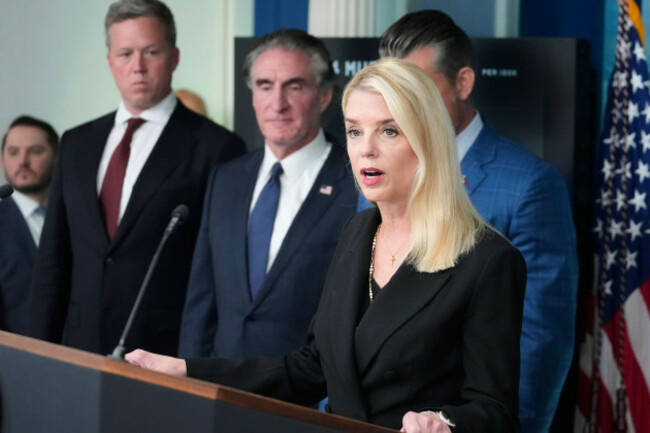 attorney-general-pam-bondi-from-right-speaks-as-interior-secretary-doug-burgum-and-army-secretary-dan-driscoll-listens-during-a-briefing-with-president-donald-trump-in-the-james-brady-press-briefing
