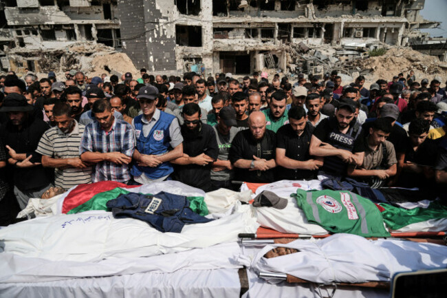 palestinians-pray-over-the-bodies-of-journalists-including-al-jazeera-correspondents-anas-al-sharif-and-mohamed-qreiqeh-who-were-killed-in-an-israeli-airstrike-during-their-funeral-outside-gaza-cit