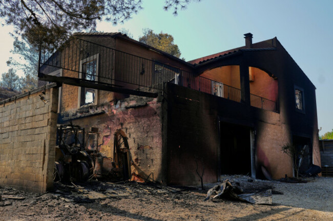 a-fire-damaged-house-is-photographed-during-frances-largest-wildfire-in-decades-in-albas-southern-france-thursday-aug-7-2025-ap-photomanu-fernandez
