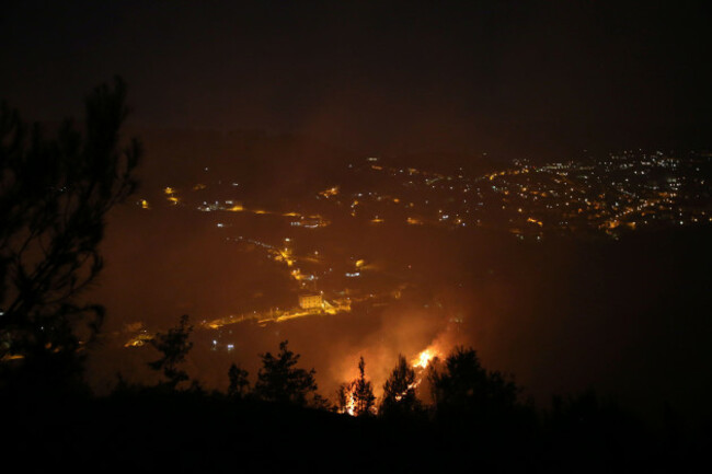 tirana-virginia-albania-12th-aug-2025-a-picture-taken-early-on-august-12-2025-shows-flames-and-smoke-rising-from-a-forest-fire-near-tirana-in-the-village-of-selite-forest-fires-have-spread-acr