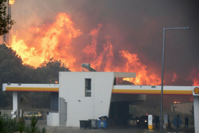 blazes-burn-near-a-gas-station-during-a-wildfire-in-the-village-of-theriano-near-patras-city-western-greece-tuesday-aug-12-2025-ap-photogiannis-androutsopoulos