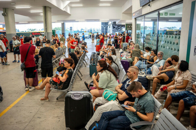 several-people-waiting-at-chamartin-clara-campoamor-station-on-august-12-2025-in-madrid-spain-train-traffic-has-been-restored-between-santiago-and-ourense-after-being-cut-off-since-145-p-m-du