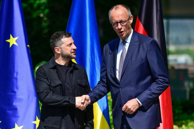 ukrainian-president-volodymyr-zelenskyy-left-is-welcomed-by-german-chancellor-friedrich-merz-upon-arrival-in-the-garden-of-the-chancellery-in-berlin-germany-wednesday-aug-13-2025-to-join-a-vide