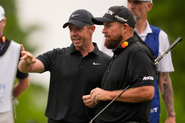 rory-mcilroy-of-north-ireland-talks-with-teammate-shane-lowry-of-ireland-right-on-the-12th-green-during-the-first-round-of-the-pga-zurich-classic-golf-tournament-at-tpc-louisiana-in-avondale-la