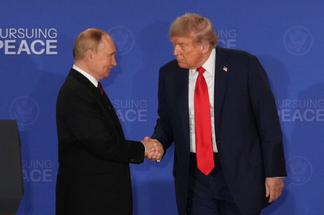 president-donald-trump-right-shakes-the-hand-of-russias-president-vladimir-putin-during-a-joint-press-conference-at-joint-base-elmendorf-richardson-alaska-friday-aug-15-2025-ap-photojae-c