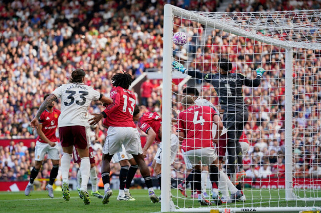 manchester-uniteds-goalkeeper-altay-bayindir-right-tries-to-reach-the-ball-before-arsenals-riccardo-calafiori-left-scored-his-sides-first-goal-during-the-english-premier-league-soccer-match-betw