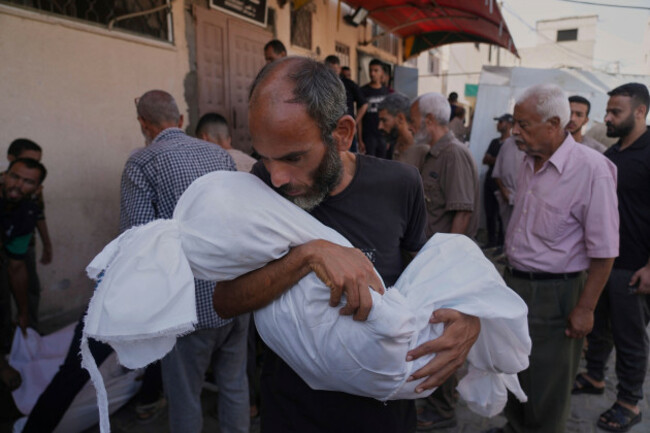 ahmed-al-hajj-carries-the-body-of-his-daughter-dana-al-hajj-13-who-was-killed-in-an-israeli-airstrike-in-the-gaza-strip-at-al-aqsa-hospital-in-deir-al-balah-tuesday-aug-19-2025-ap-photoabde