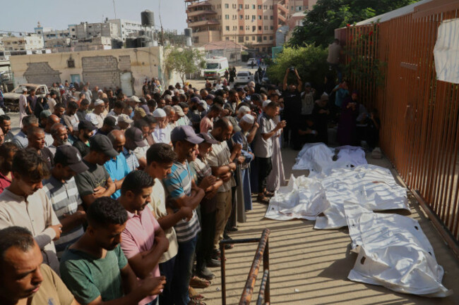 palestinians-pray-over-the-bodies-of-people-who-were-killed-in-an-israeli-airstrike-during-their-funeral-outside-nasser-hospital-in-khan-younis-in-the-southern-gaza-strip-tuesday-aug-19-2025