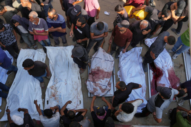 palestinians-mourn-over-the-bodies-of-people-killed-either-by-israeli-military-strikes-or-while-trying-to-reach-aid-trucks-outside-shifa-hospital-in-gaza-city-thursday-aug-21-2025-ap-photojeh