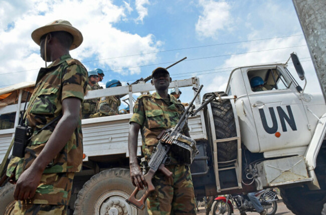 goma-democratic-republic-of-congo-a-u-n-peacekeeping-mission-vehicle-passes-fighters-of-the-m23-rebel-movement-in-goma-in-the-eastern-part-of-the-democratic-republic-of-the-congo-on-dec-1-2012