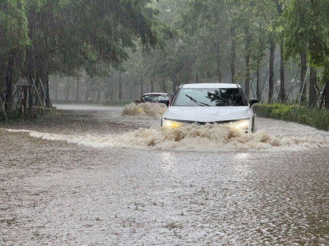 streets-of-the-capital-city-hanoi-are-flooded-due-to-heavy-rain-after-typhoon-kajiki-passed-through-vietnam-tuesday-aug-26-2025-ap-photohau-dinh