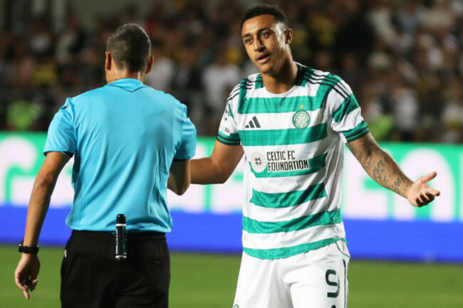 celtics-adam-idah-right-speaks-with-referee-maurizio-mariani-during-the-champions-league-playoff-second-leg-soccer-match-between-kairat-and-celtic-at-ortalyk-stadium-in-almaty-kazakhstan-tuesday