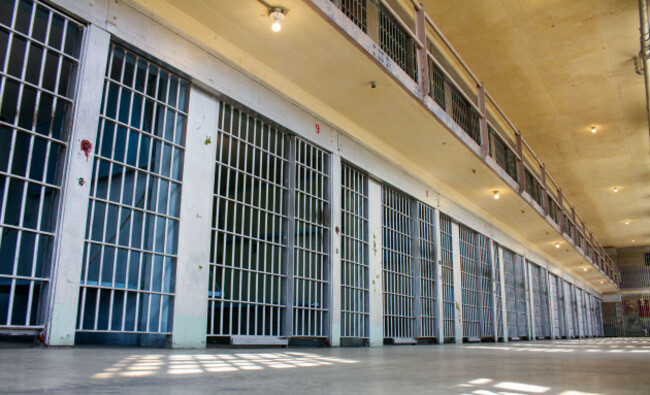 a-prison-cell-block-with-many-cells-and-bars