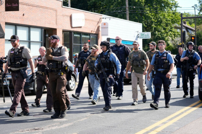 law-enforcement-officers-gather-outside-the-annunciation-churchs-school-in-response-to-a-reported-mass-shooting-wednesday-aug-27-2025-in-minneapolis-ap-photoabbie-parr